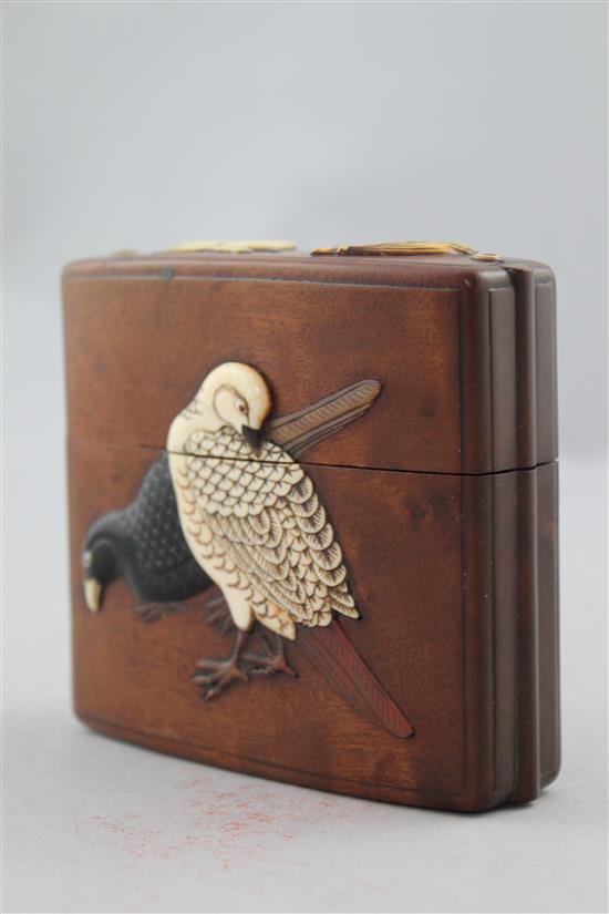 A Japanese cherrywood, ivory, horn, mother of pearl and wood inlaid single case inro, 19th century, 9cm.